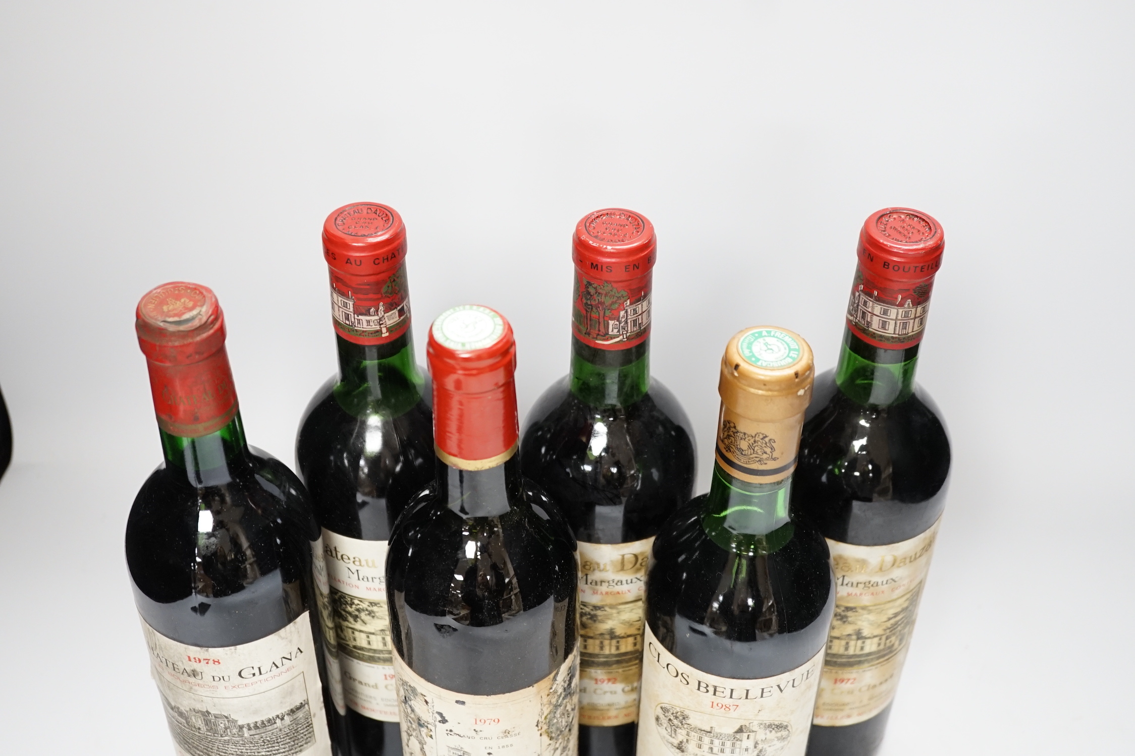 Three bottles of Chateau Dauzac Margaux 1972 and three other bottles Chateau Du Glana Saint Julien 1978, Chateau Lagrange Saint Julien 1979 and Clos Bellevue Margaux 1987